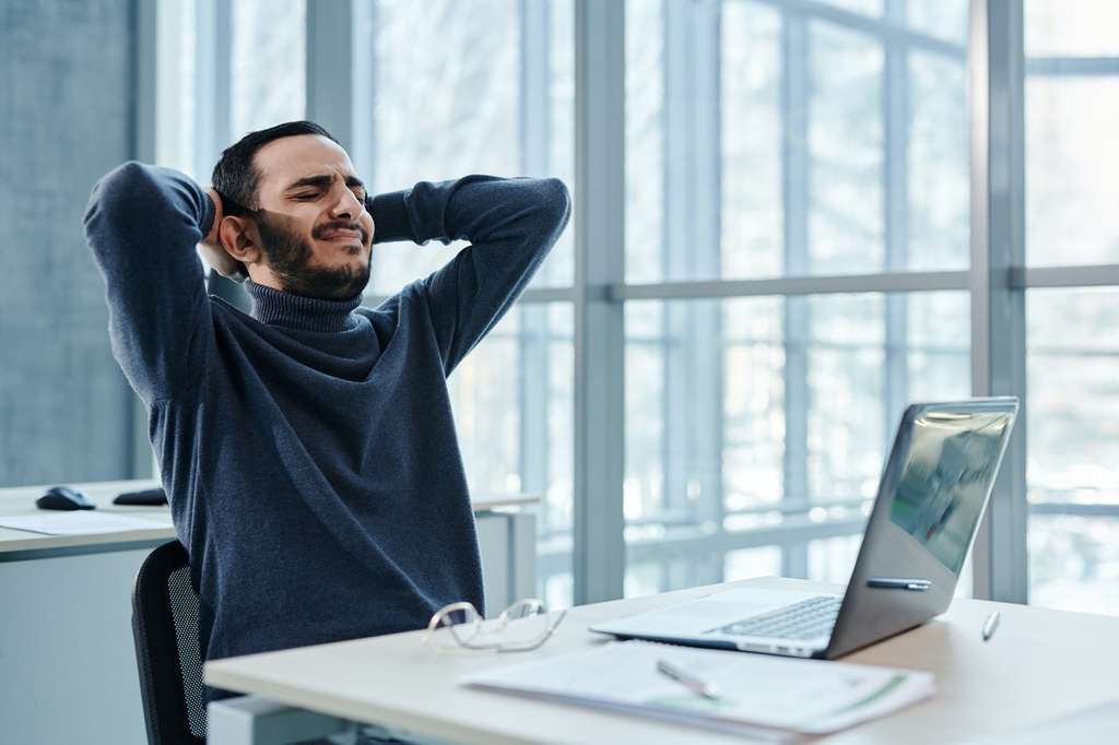 employee sitting at desk high