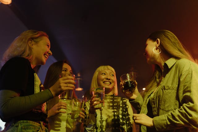 Four friends drinking alcohol