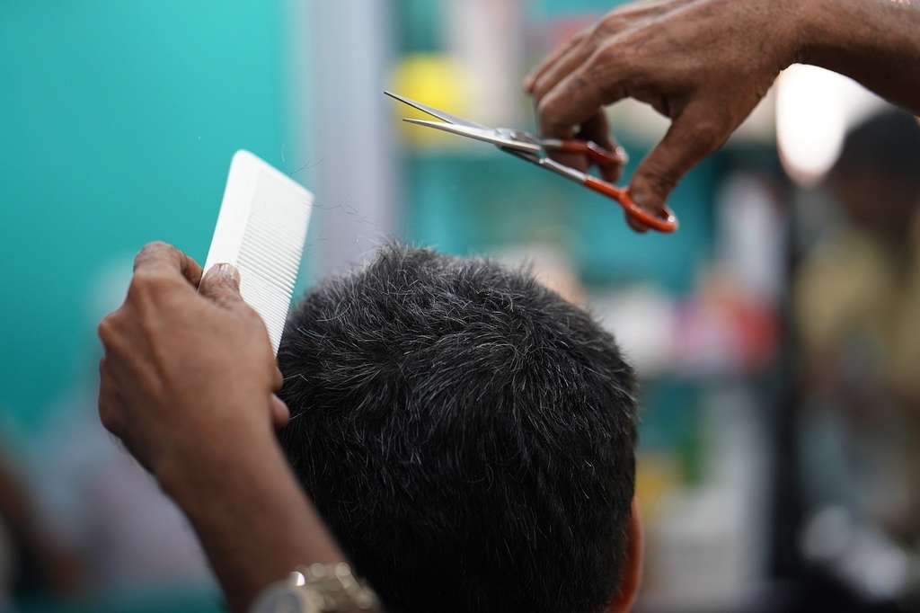 hairdresser cutting hair