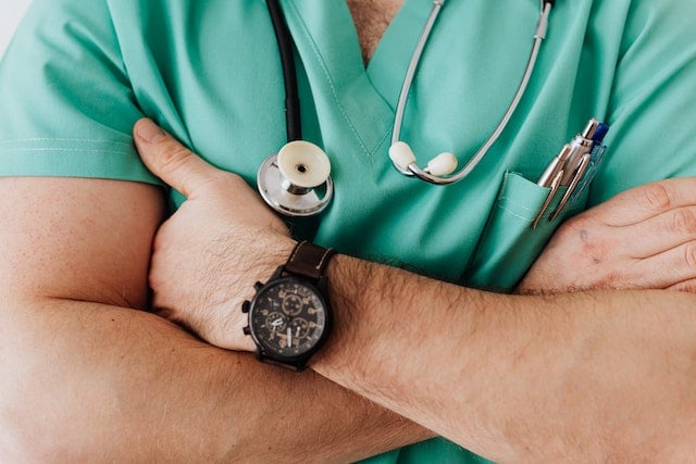 male doctor with arms crossed