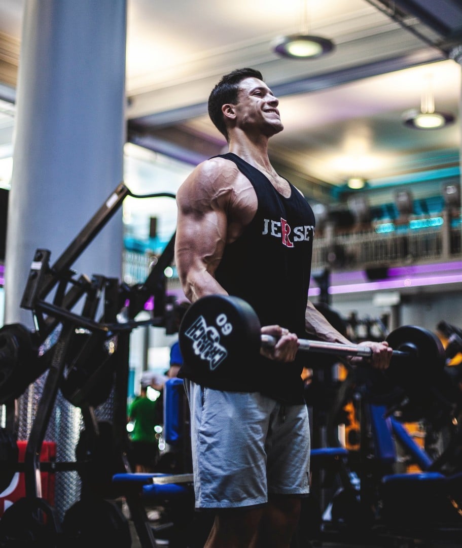 Man doing bicep curls in the gym