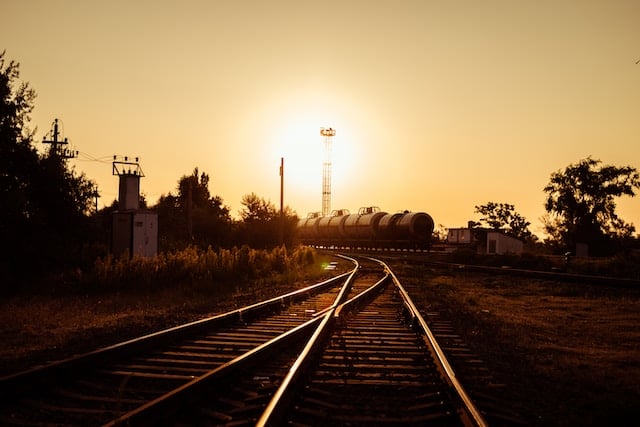 train on the tracks at sunset