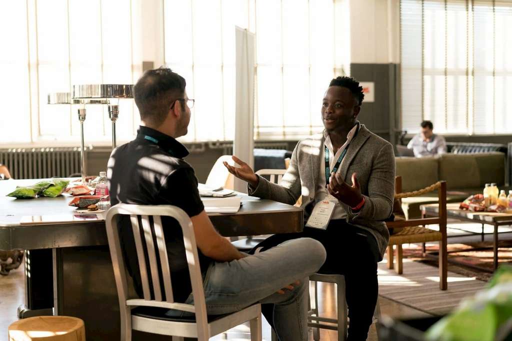 two men in a meeting