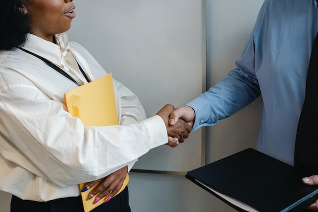 two people shaking hands