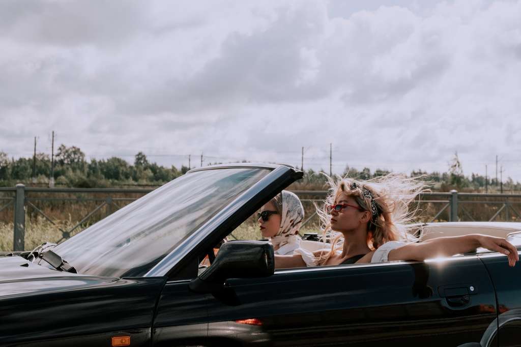 women driving while high in convertible