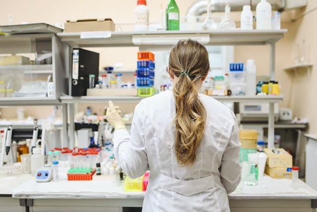 scientist conducting laboratory tests using hair samples