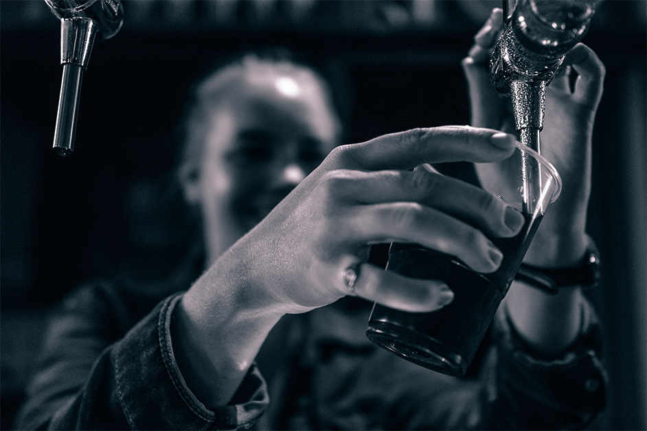 bartender pouring glass of beer