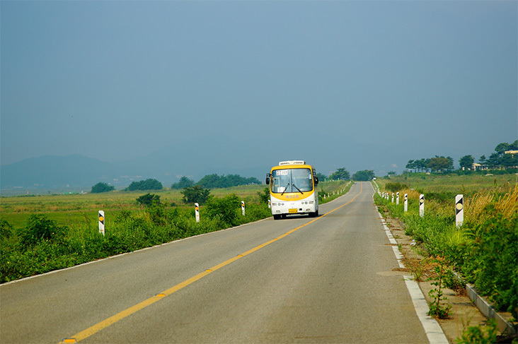 bus driving down the road