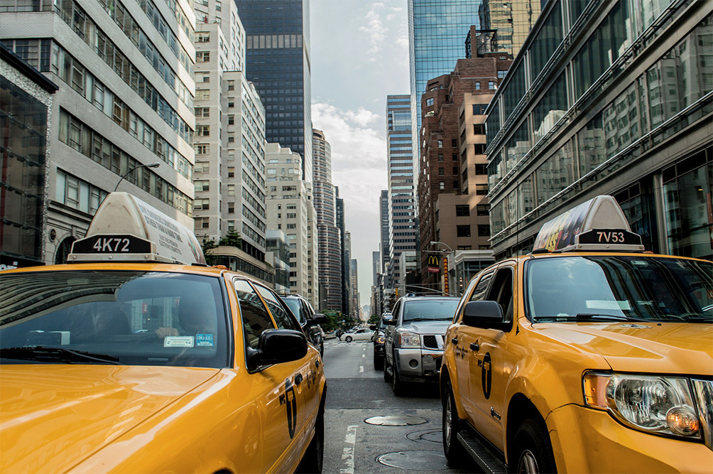 cabs driving down the road