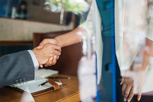 coworkers shaking hands