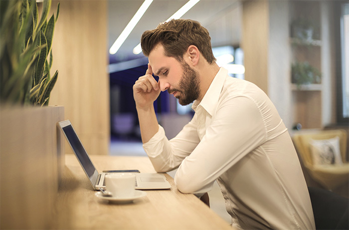 man sitting at his laptop