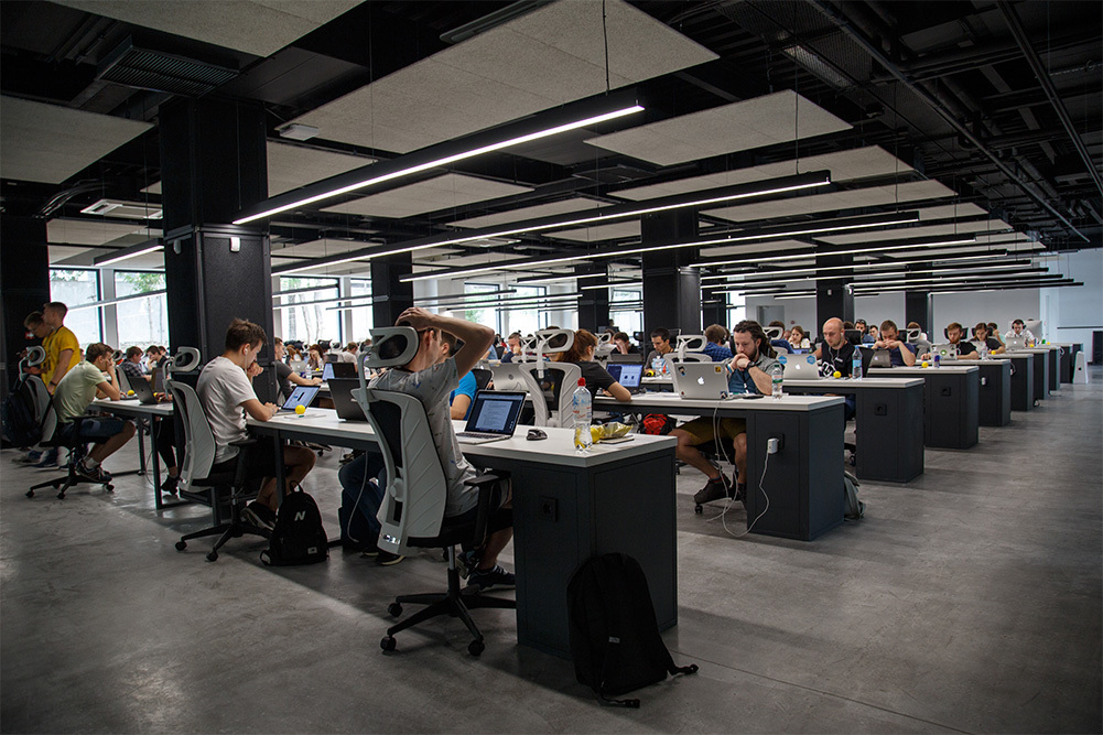 employees sitting at rows of tables