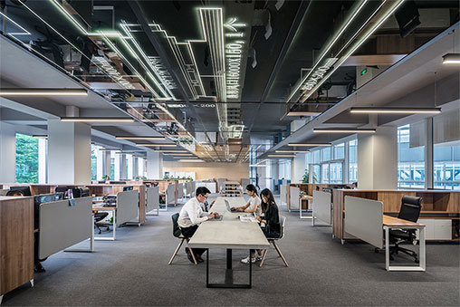 employees sitting at a table at work