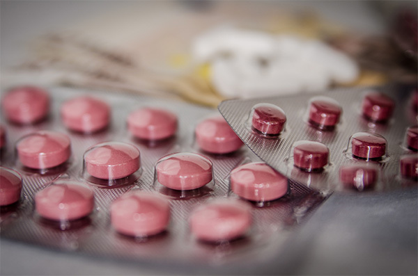 pink round pills in packets