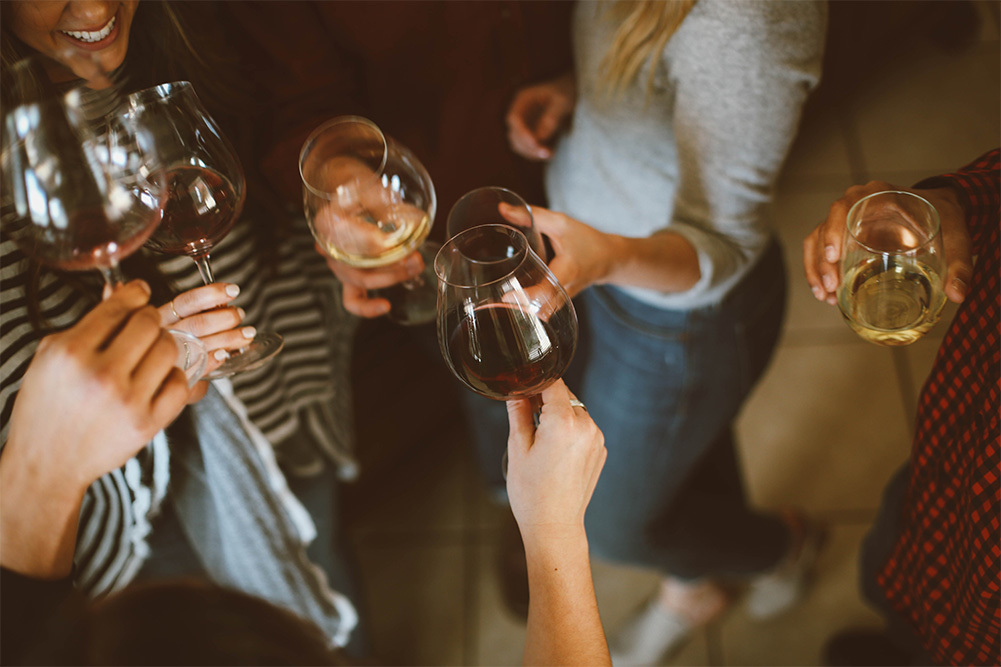 people drinking glasses of wine before a hair alcohol test