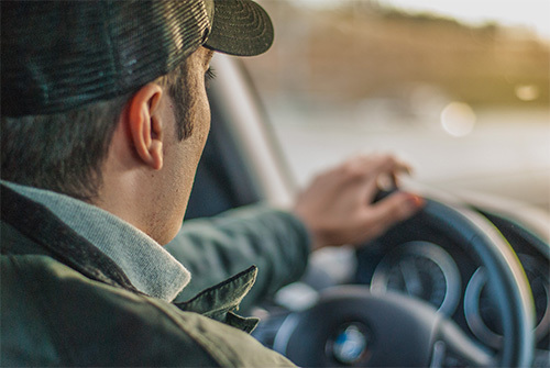 man driving car