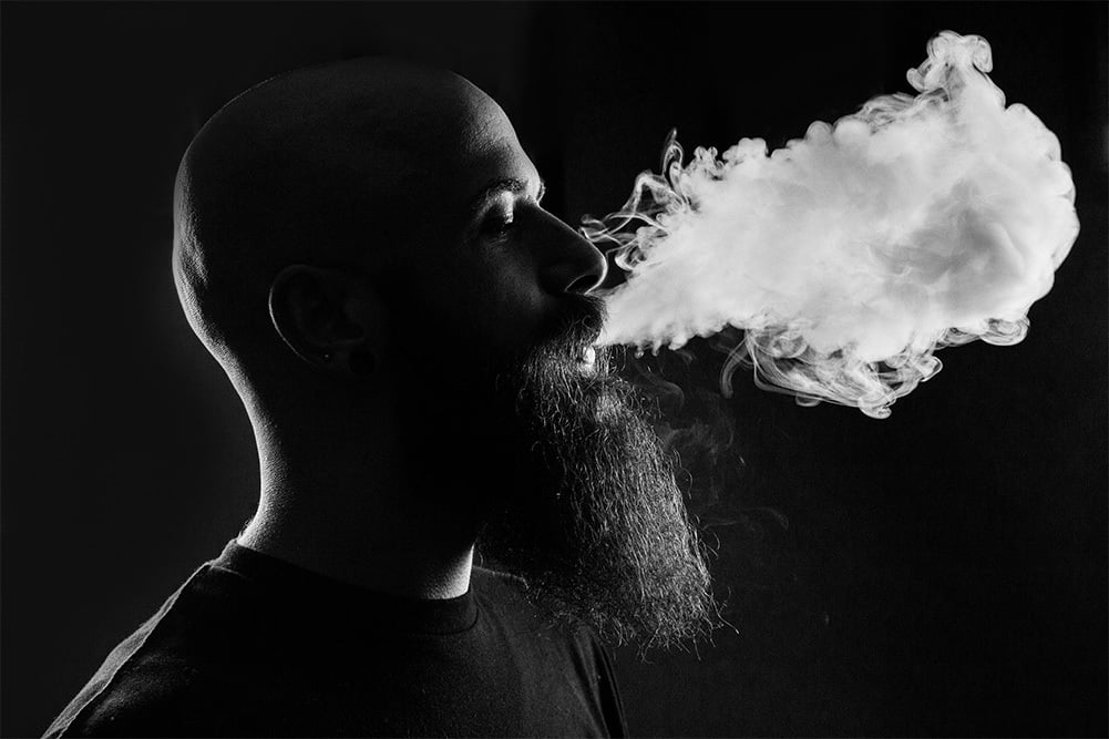 man with smoke coming out of his mouth