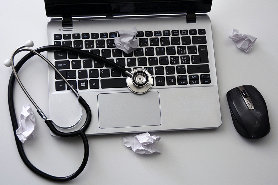 laptop with a stethoscope on it