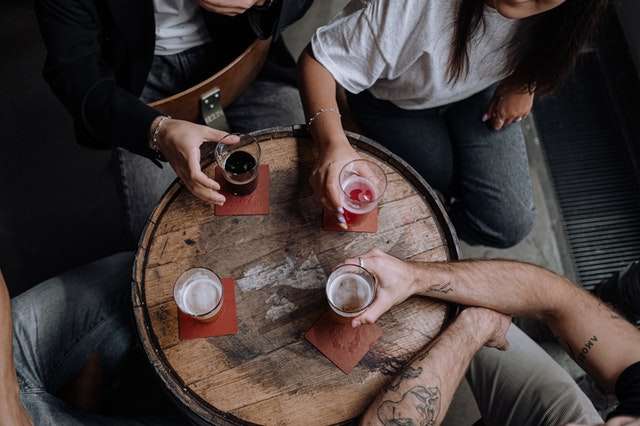 people holding drinks