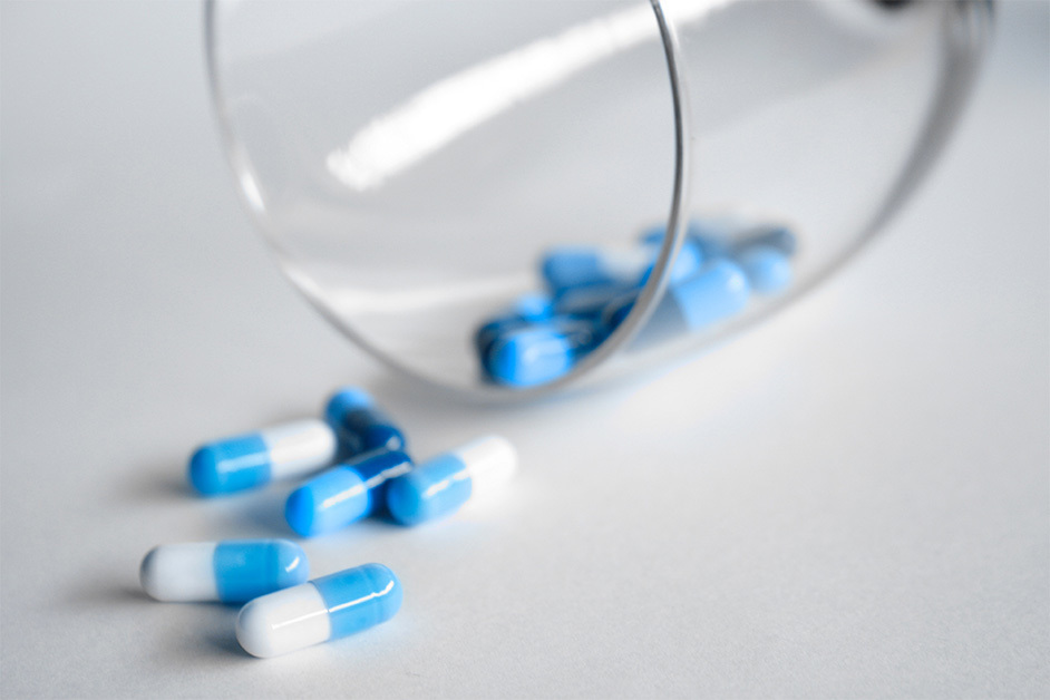 pills in a wine glass