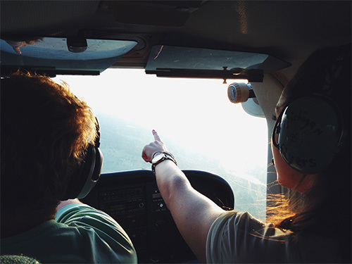 pilot pointing out window