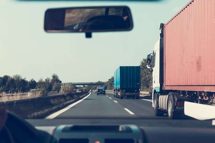 trucks and cars on the highway