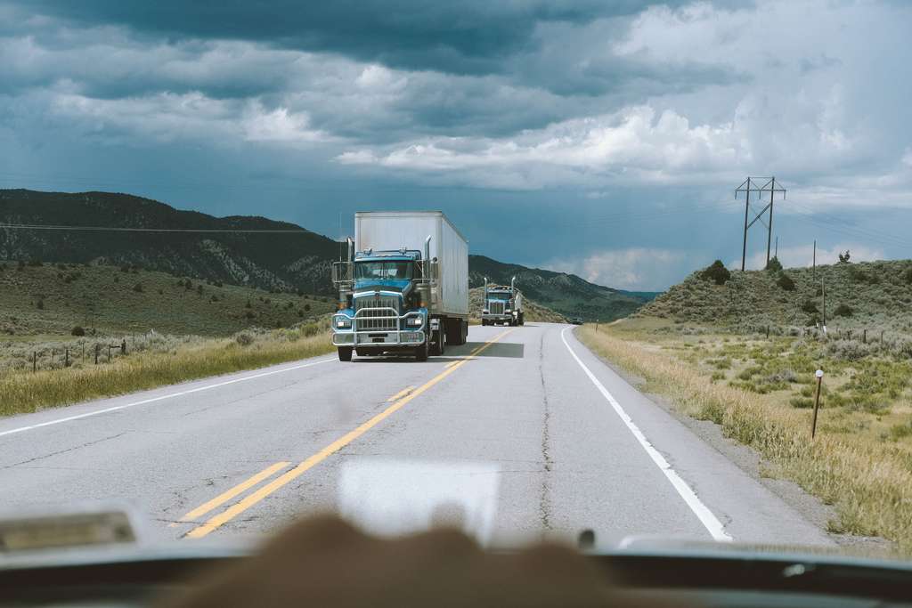 trucks driving on the road