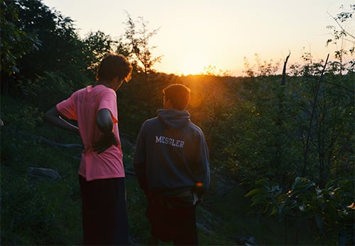 two friends talking outside