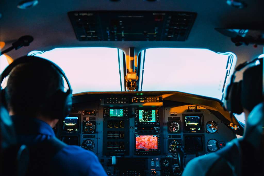 Two pilots in an airplane's cockpit