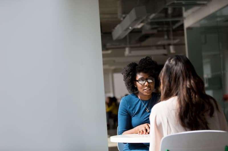 two women in a meeting