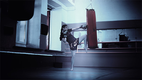 woman using punching bag